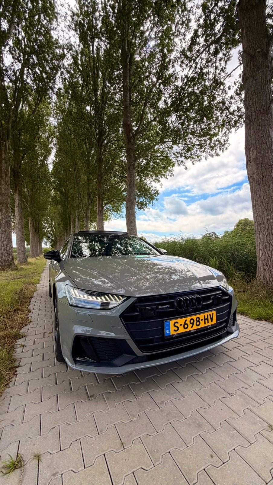 Audi A7 55 Tfsi e Quattro 450pk S Tronic 2020 Nardo, Auto's, Plug-in hybride, Vierwielaandrijving, 129 €/maand, Te koop