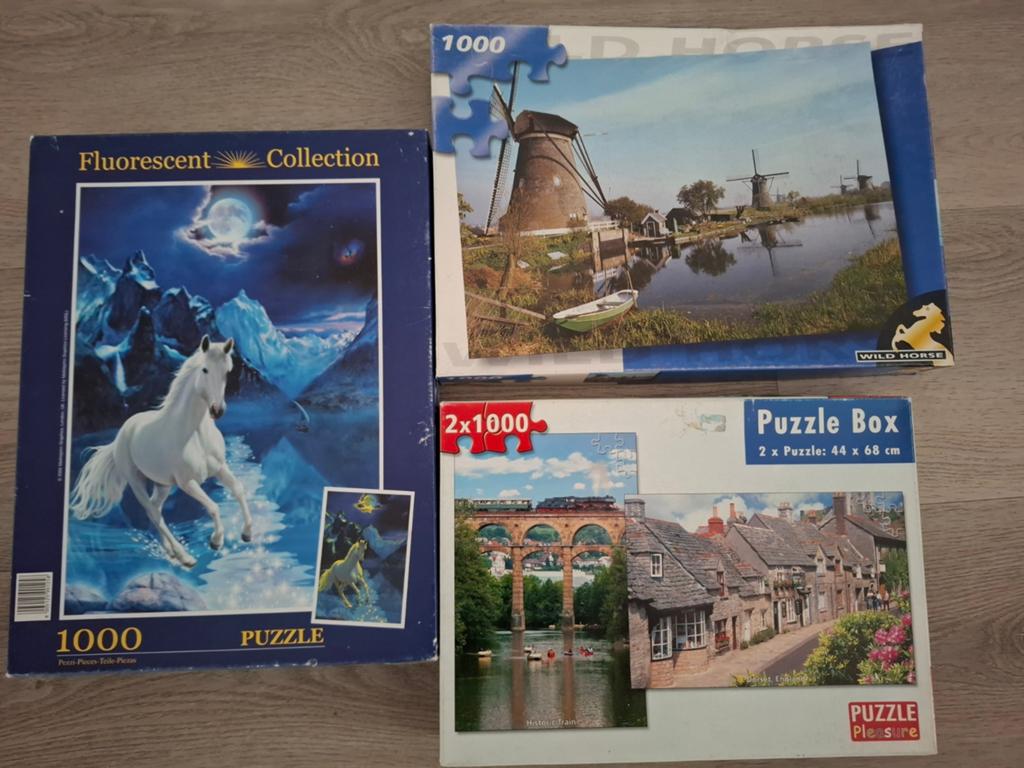 4 puzzels 1000 stukjes, Ophalen of Verzenden, 500 t/m 1500 stukjes, Zo goed als nieuw