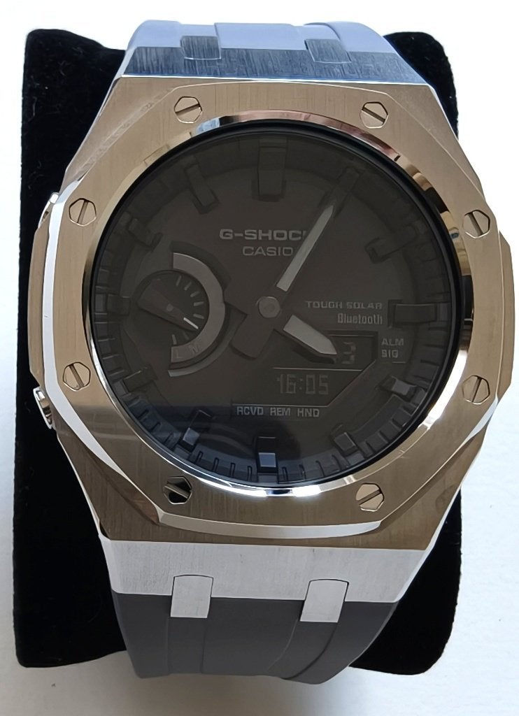 8 horloges in display box G-Shock / Militado en meer, Overige materialen, Polshorloge, Overige materialen, Zo goed als nieuw