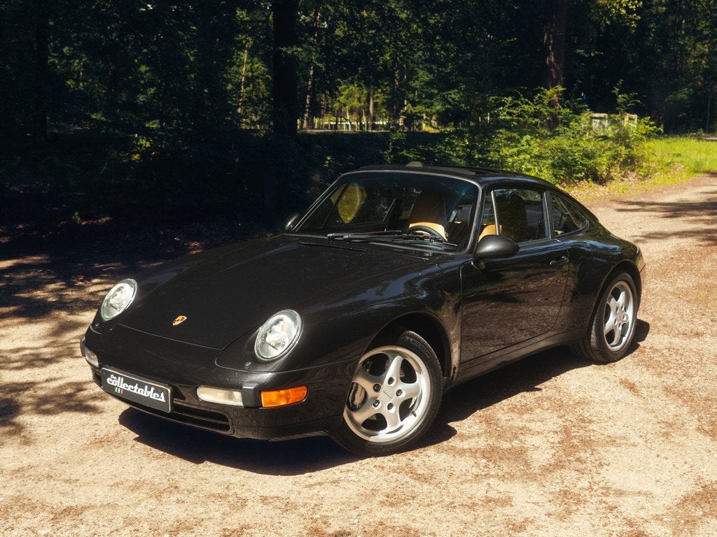 Porsche 911 3.6 Carrera 4 Coupé Handgeschakeld (bj 1995), Auto's, Oldtimers, Cruise Control, 4 stoelen, Zwart, Bedrijf