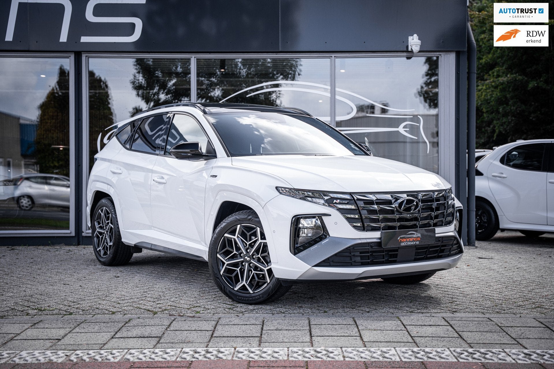 Hyundai Tucson 1.6 T-GDI HEV Premium|Trekh|Pano|Stoelverwami, Auto's, Gebruikt, 4 cilinders, 1650 kg, Wit