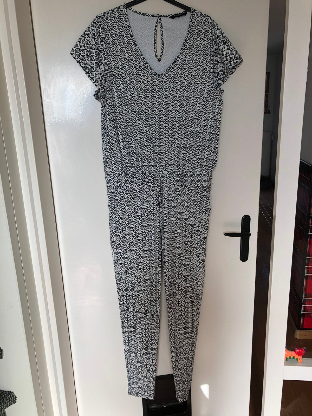Travelstof jumpsuit Lady Day M/L, Kleding | Dames, Jumpsuits, Ophalen of Verzenden, Zo goed als nieuw, Maat 42/44 (L), Zwart