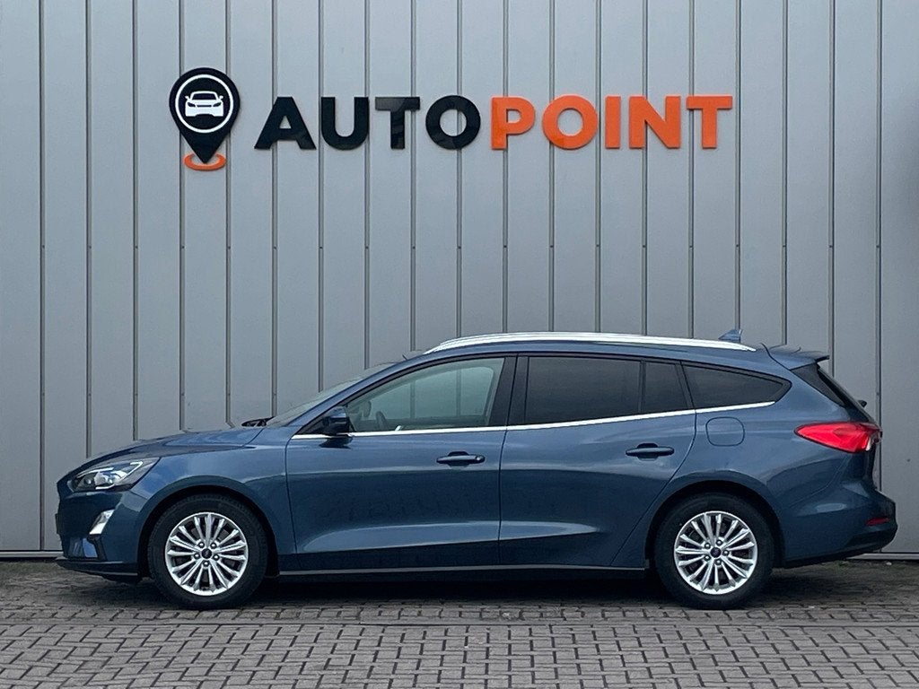 Ford Focus Wagon 1.0 Titanium X Business AUTOMAAT 1E EIG DEA, Auto's, Ford, 1328 kg, Gebruikt, Euro 6, Blauw