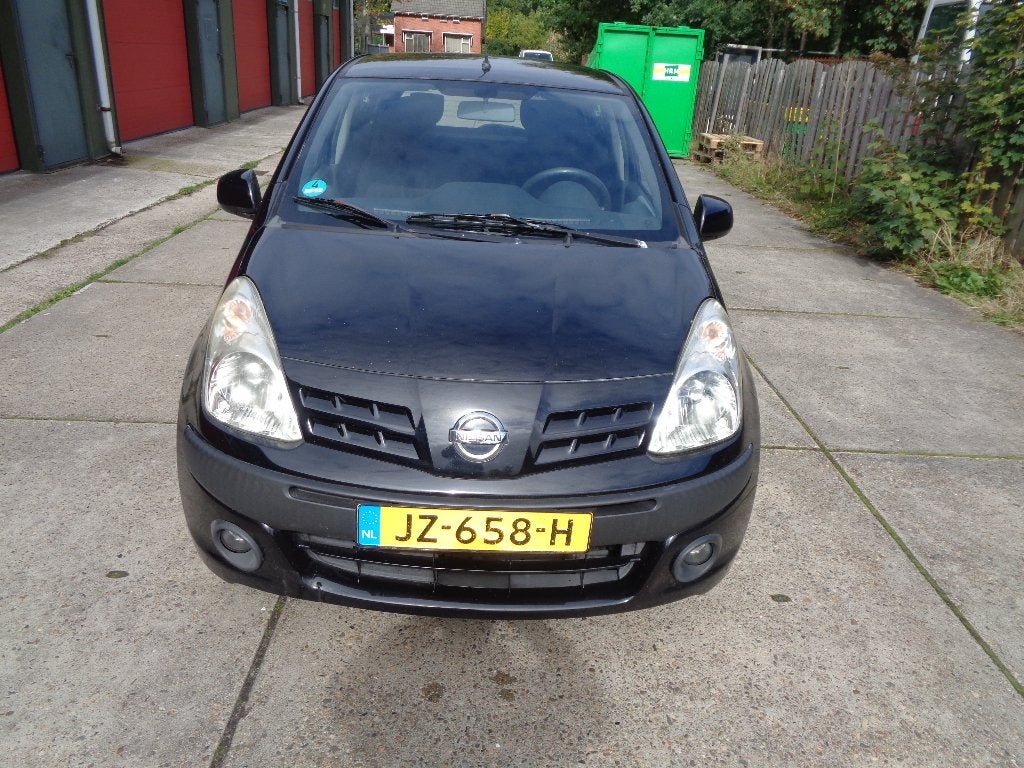 Nissan Pixo 1.0 50KW 5D 2010 Zwart, Auto's, Voorwielaandrijving, Stof, 4 stoelen, Bedrijf