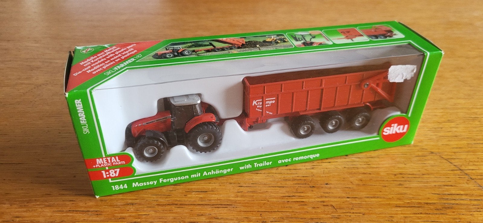 Siku 1844 Massey Ferguson met trailer, Hobby en Vrije tijd, Modelauto's | 1:87, Ophalen of Verzenden, Zo goed als nieuw, Hijskraan, Tractor of Landbouw