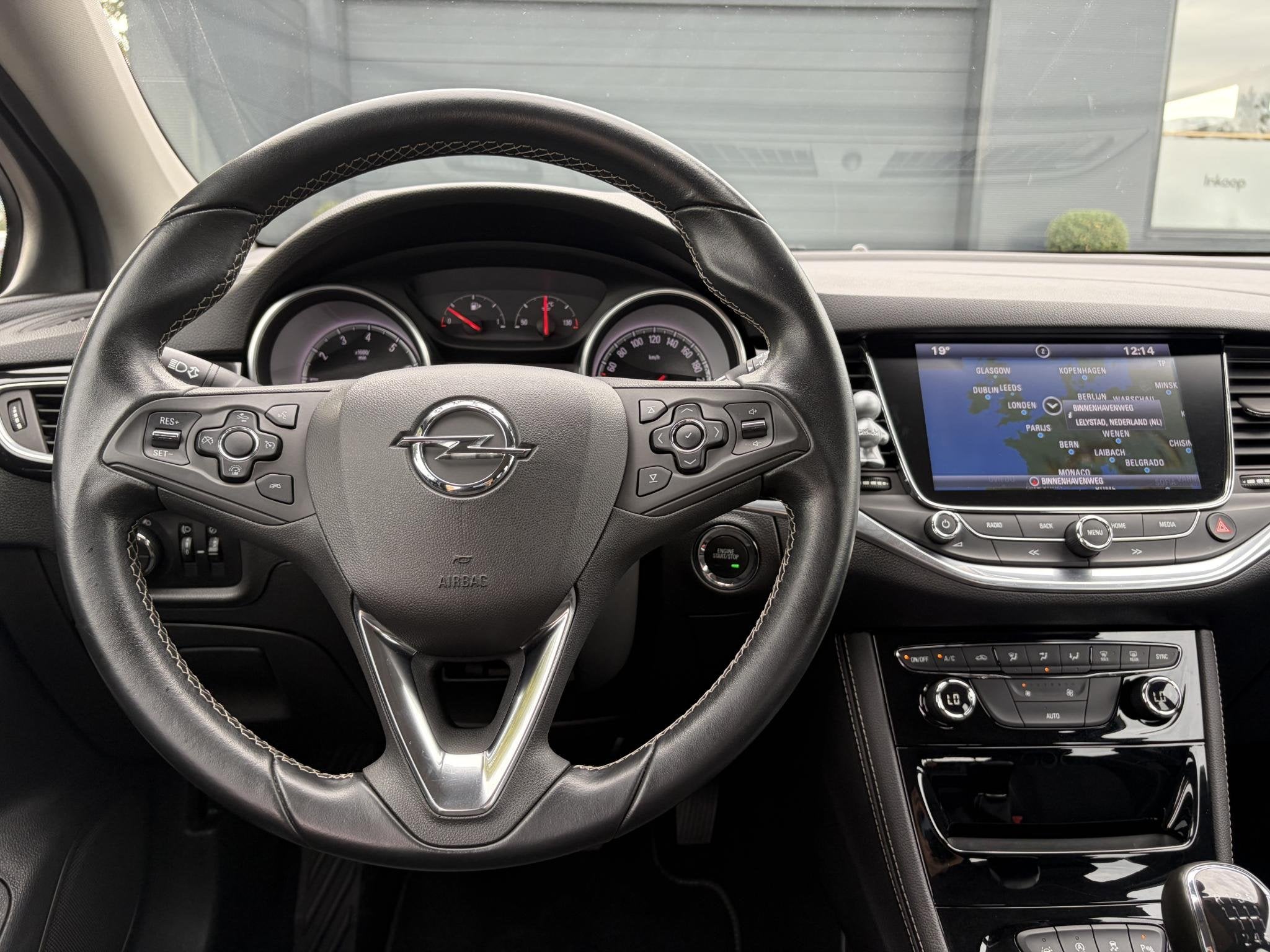 Opel Astra 1.4 Innovation 2e EigenaarCarplayNavi, Auto's, Stof, Gebruikt, 4 cilinders, Parkeersensor