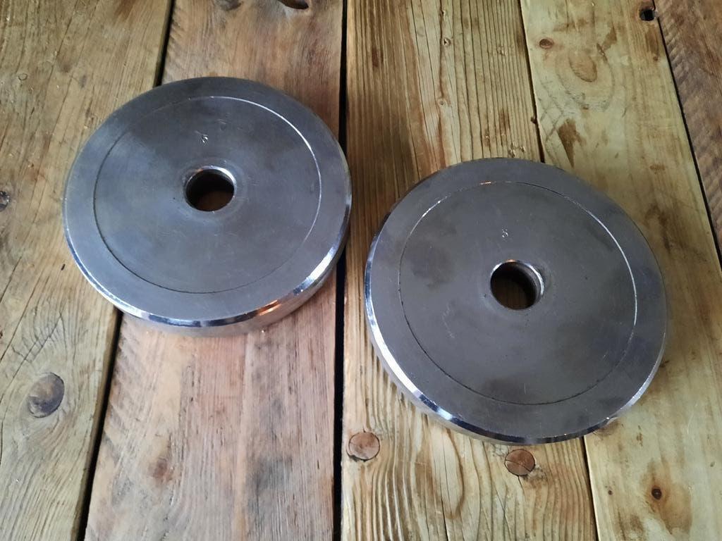 Halterschijven  2x5 Kg, Ophalen of Verzenden, Zo goed als nieuw, Benen, Halterschijven