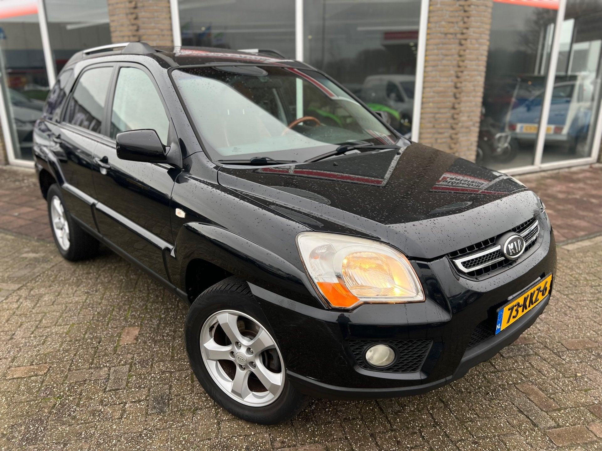 Kia Sportage 2.0 CVVT Fifteen - Leer - Clima - Cruise -, Auto's, 1442 kg, Gebruikt, Zwart, 4 cilinders