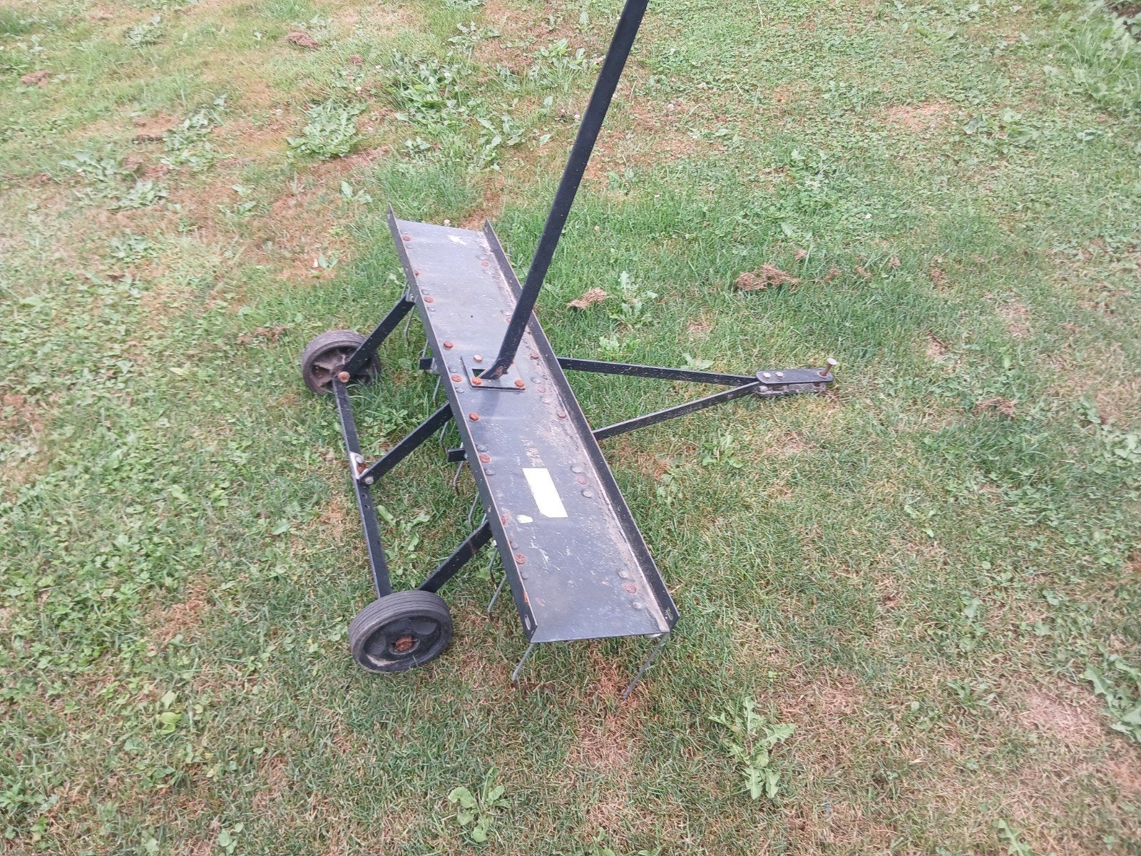 verticuteer hark zitmaaier, Ophalen