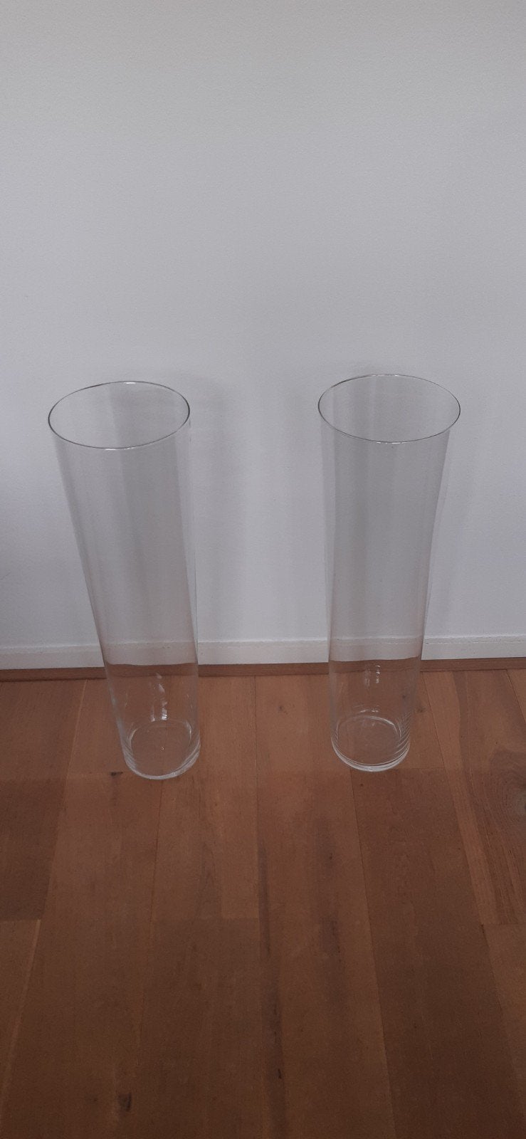 Twee grote glazen vazen van 65 cm hoog., Huis en Inrichting, Ophalen, Transparant, 65 cm, Glas