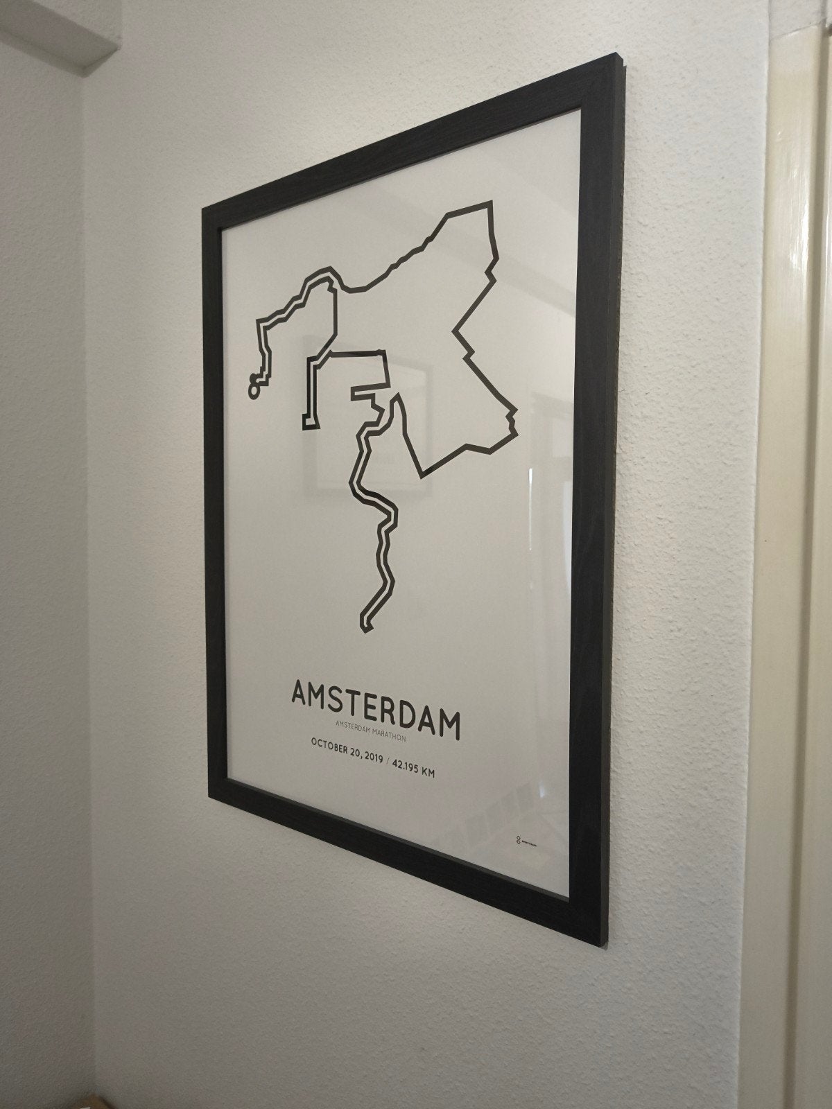 lijst met poster van marathon Amsterdam parcours, Ophalen