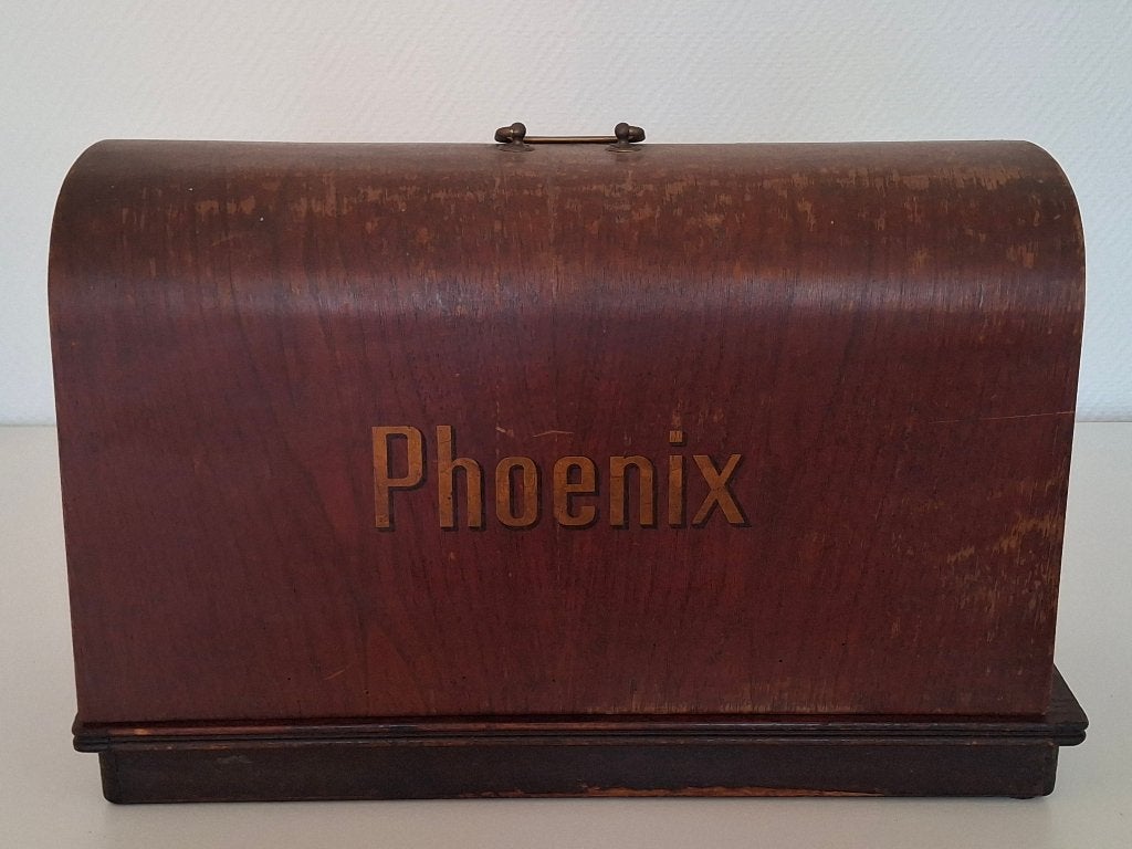 Phoenix naaimachine, Ophalen