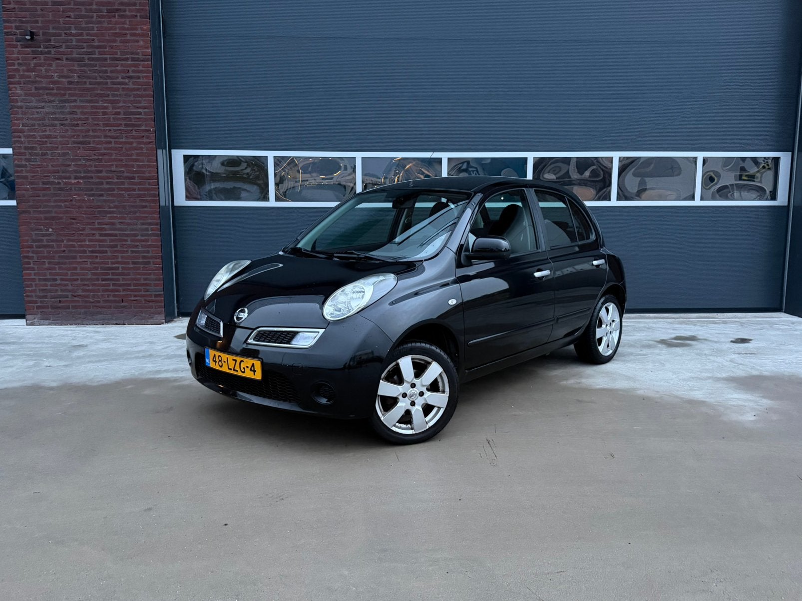 Nissan Micra 1.2 5DRS | AIRCO | NAVI | ONDERHOUDEN AUTO |, Stof, Zwart, 4 cilinders, Zwart
