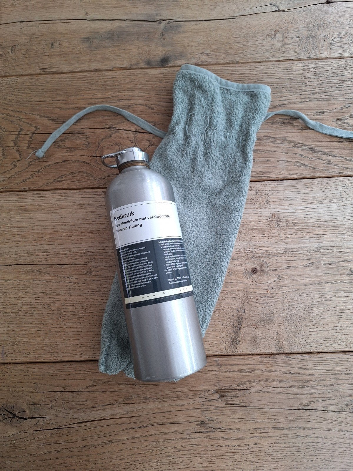 Bedkruik met groene badstof hoes, Ophalen