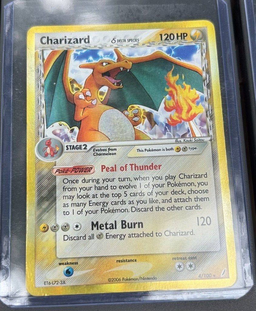 Pokémon Charizard 4/100 2006 Delta Species, Ophalen of Verzenden, Zo goed als nieuw, Losse kaart