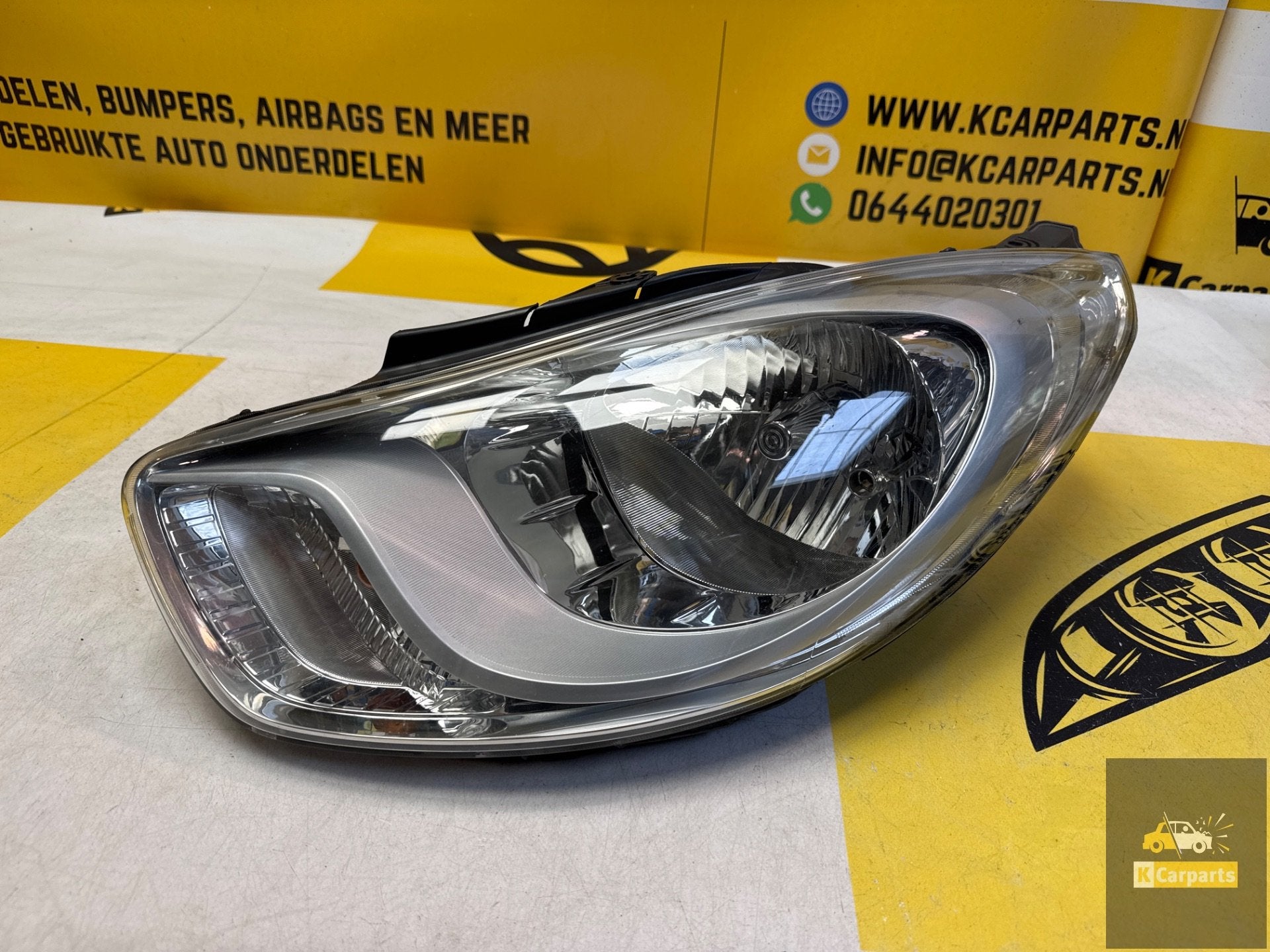 Hyundai i10 links voor koplamp origineel LHD13002 koplamp, Info@fabrikant.eu, Fabrikantstraat 1
1000 AA  Amsterdam, NL, Ophalen of Verzenden