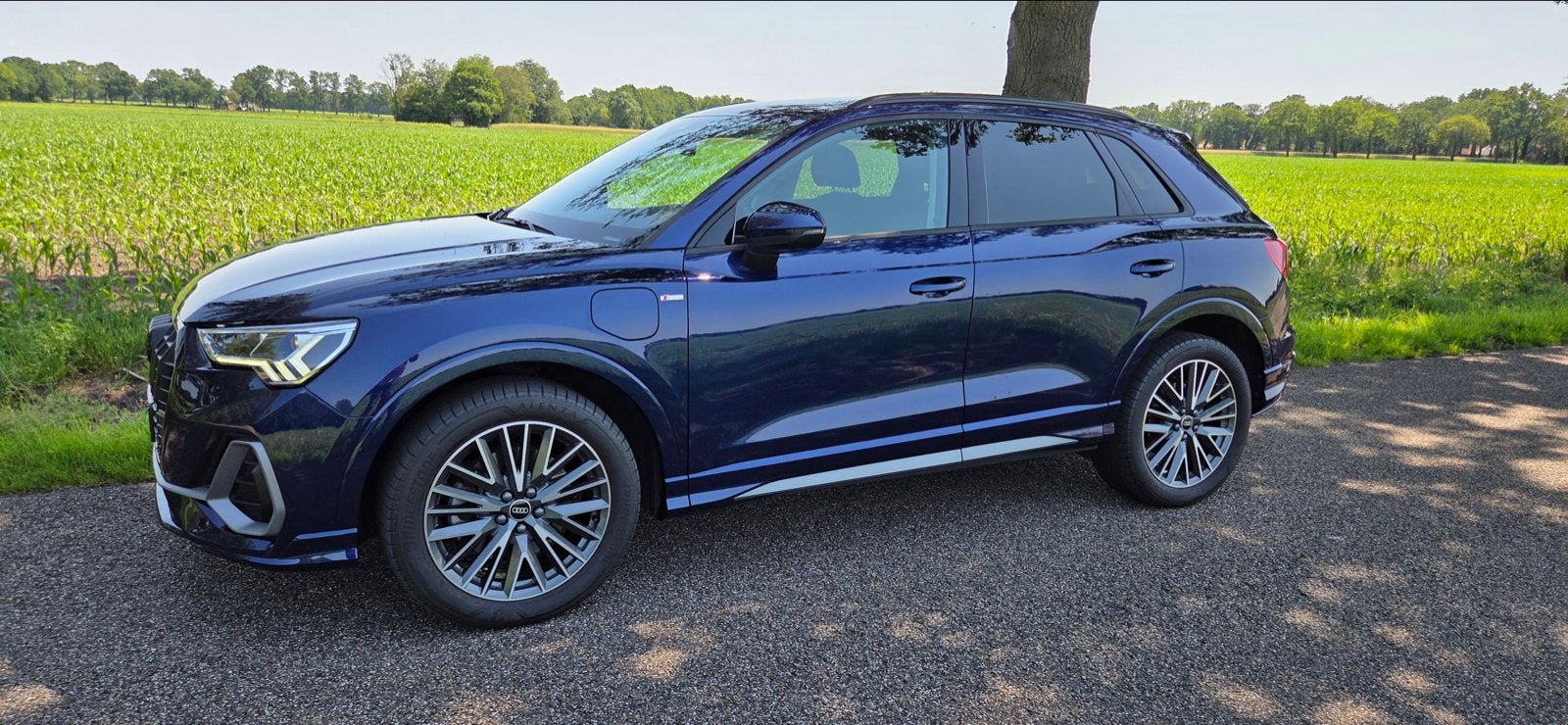 Audi Q3 45 Tfsi e 245pk Phev S-line, Auto's, Audi, Zwart, Blauw, 1395 cc, Dealer onderhouden