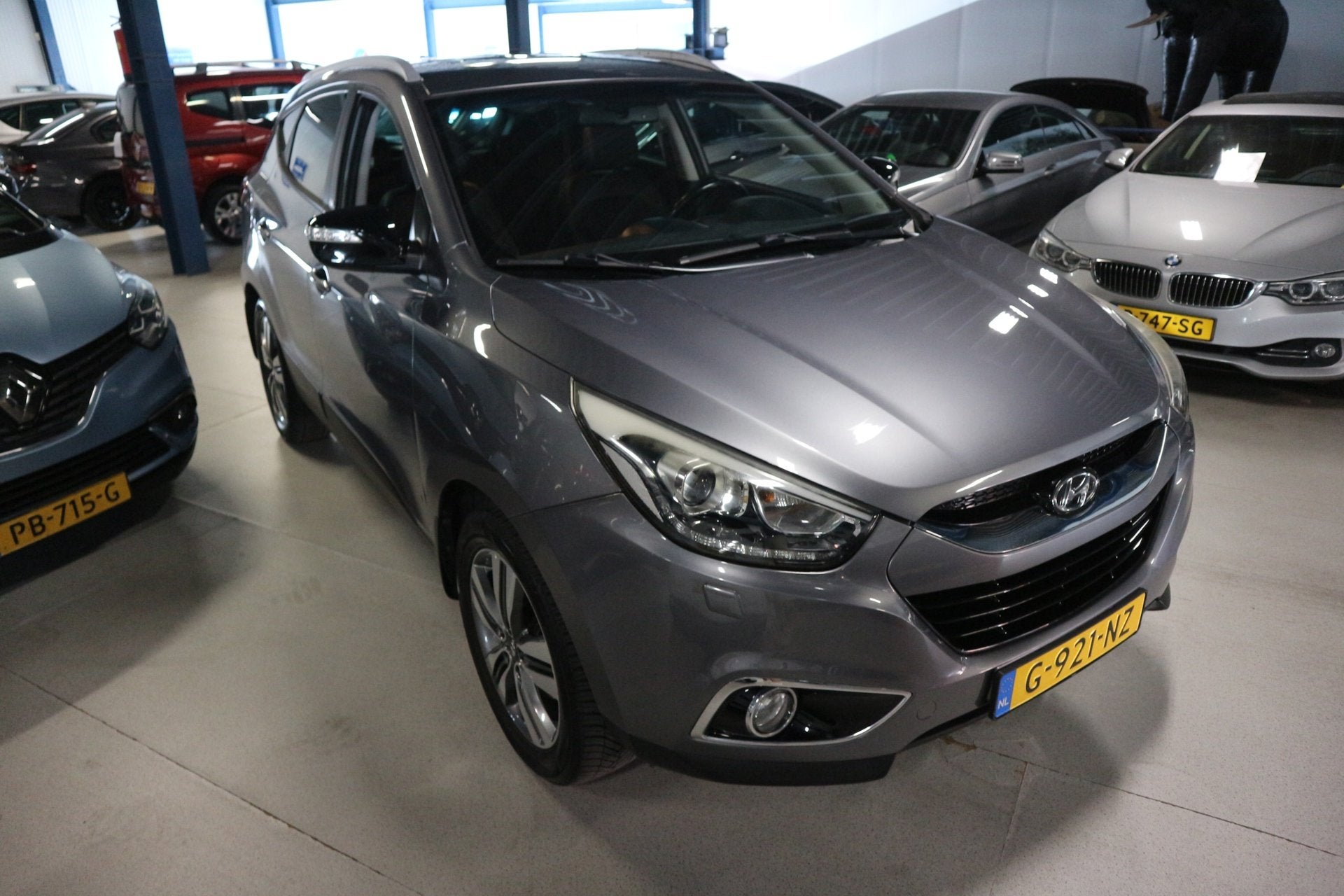 Hyundai Ix35 2.0i 4WD Business Edition / NAV / STUUR VERWARM, Euro 5, Gebruikt, 4 cilinders, Leder en Stof
