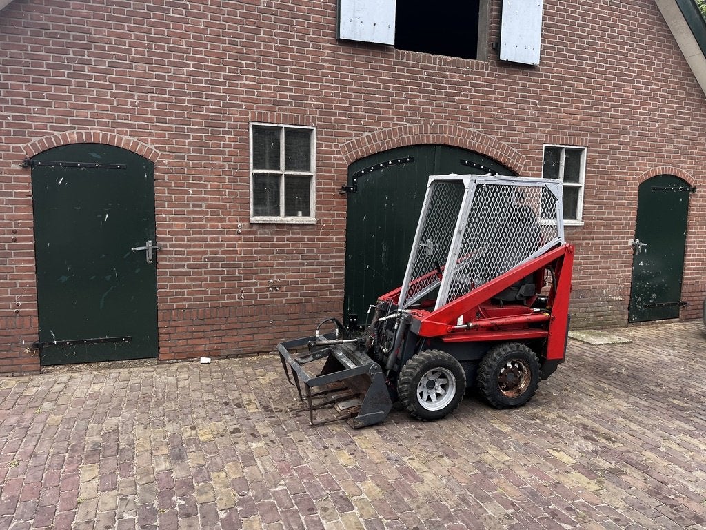 Bobcat, schranklader met mestklem