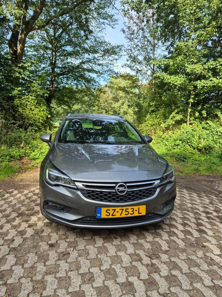 Opel Astra 1.4 Turbo 110KW Sports Tourer AT 2018 Grijs, Auto's, Overige bekleding, Stationwagon, 1240 kg, Particulier