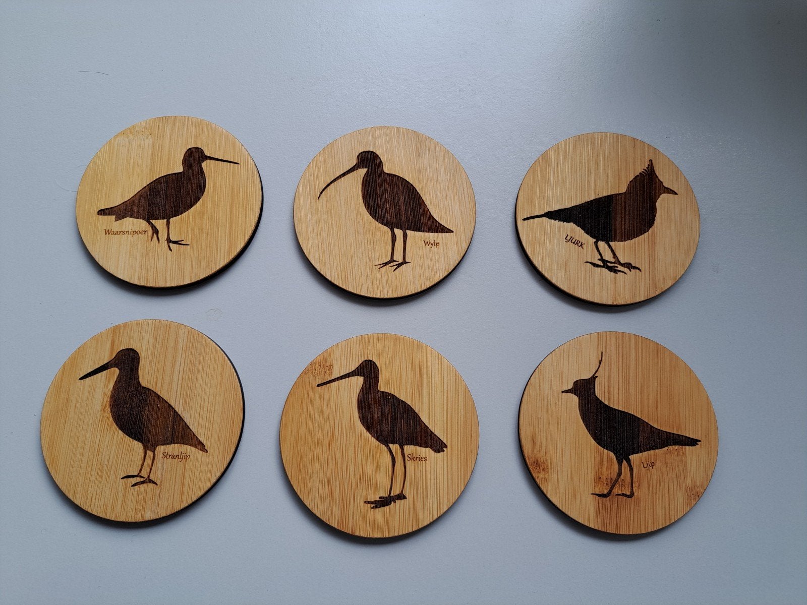Onderzetters van bamboe met weidevogels als opdruk., Ophalen of Verzenden, Glas of Kopje