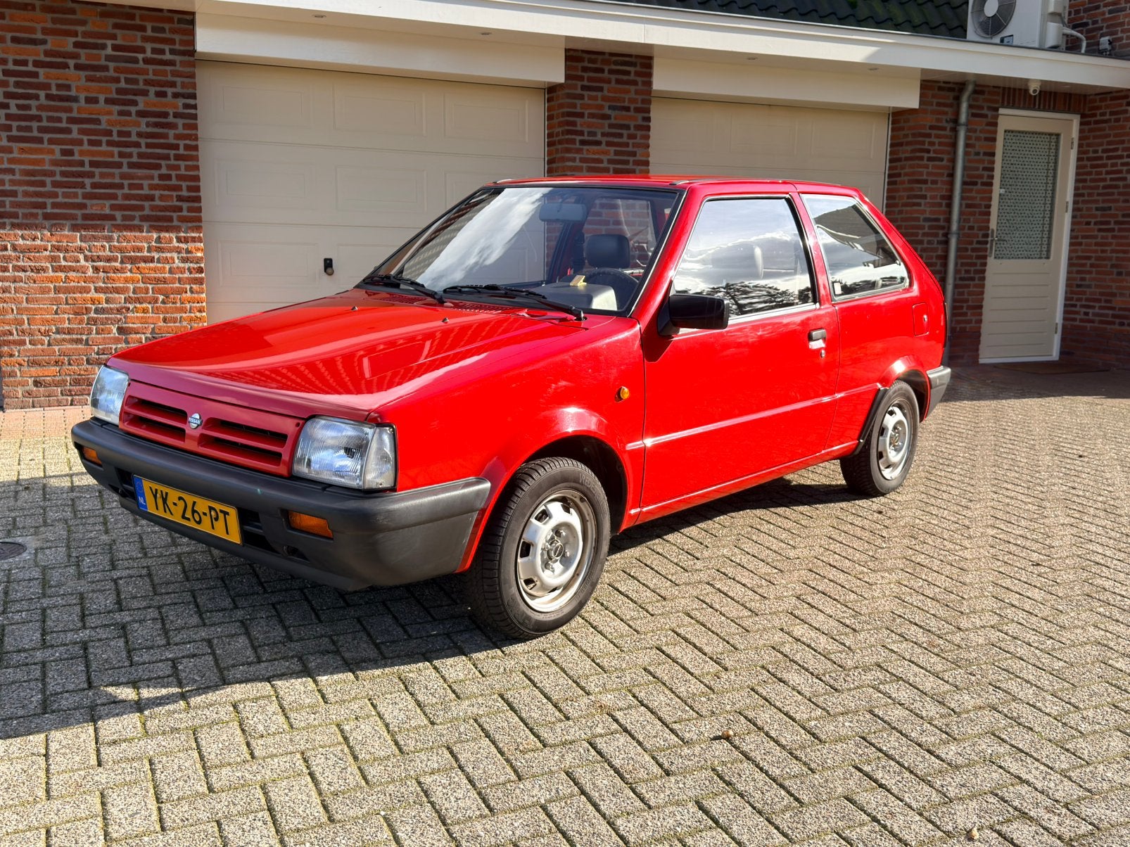 Nissan Micra 1.2 AUT U9 1990 Rood, Stof, 54 pk, 4 cilinders, Origineel Nederlands