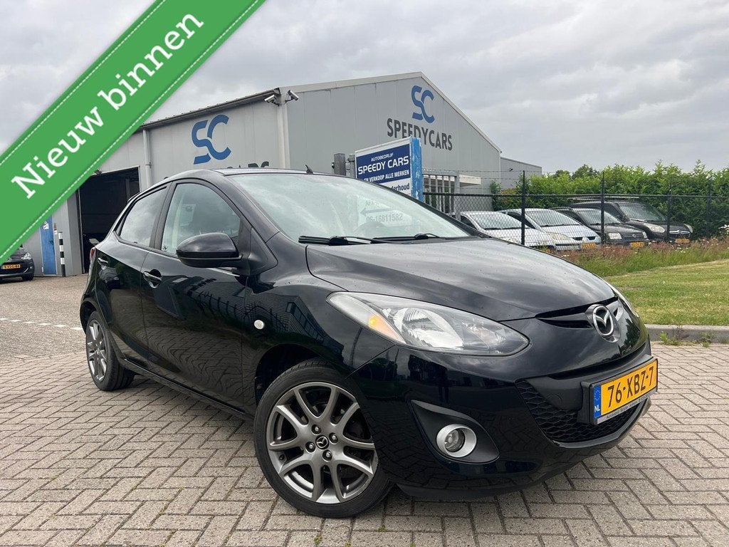 Mazda 2 1.3 BIFUEL Navigator GT 2012 LPG G3 Cruise Navi 5DRS, Auto's, Mazda, Voorwielaandrijving, Stof, Zwart, 4 cilinders