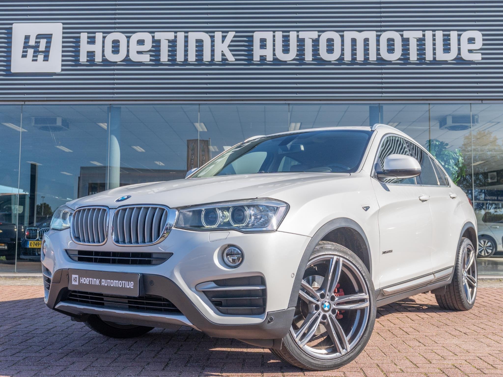 BMW X4 XDrive35i High Executive | Memory | Camera | Afn trek, Auto's, Automaat, Gebruikt, 2000 kg, Leder en Stof