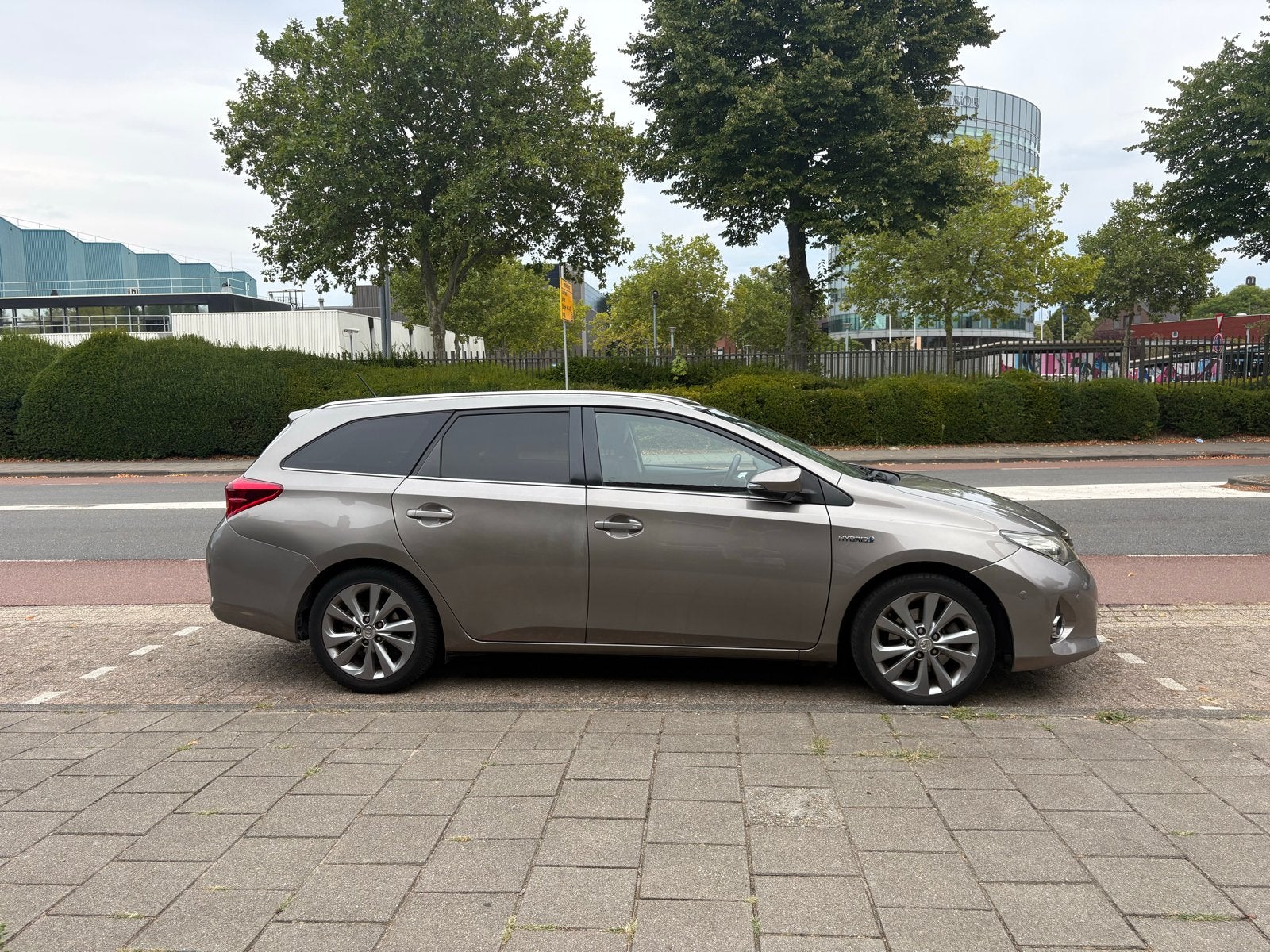 Toyota Auris 1.8 Hybrid Touring Sports CVT 2013 Bruin, Zwart, 345 kg, Bruin, Leder en Stof