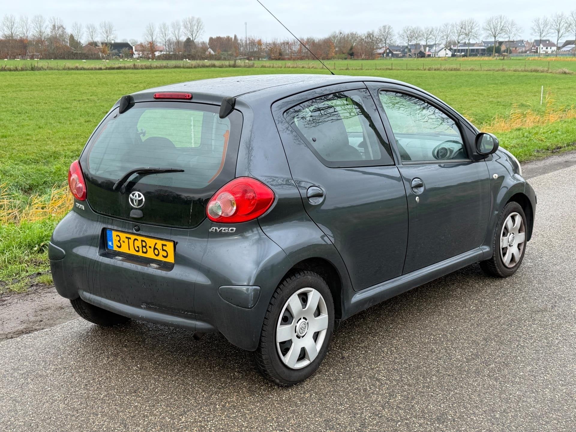 Toyota Aygo 1.0-12V LEES TEKST! GEEN APK Airco 5Drs NAP, Voorwielaandrijving, Stof, Gebruikt, Zwart