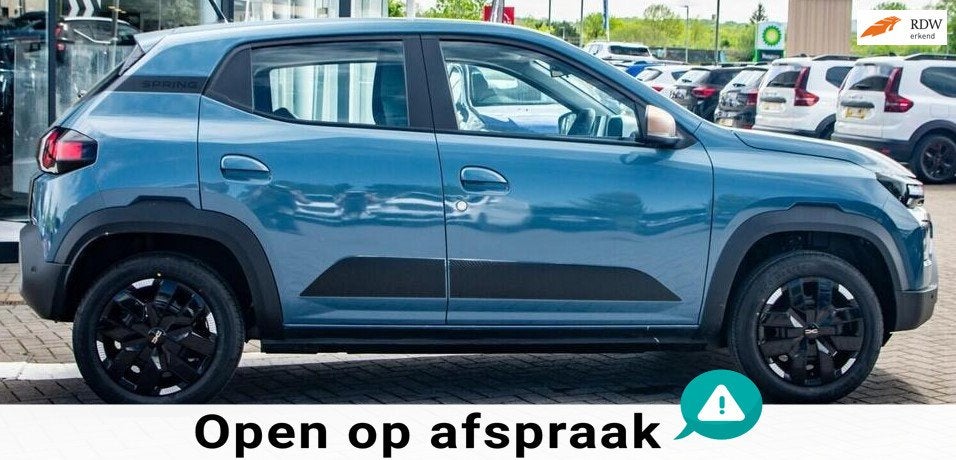 Dacia Spring Extreme 65 26.8 kWh NIEUWSTAAT NAVI AIRCO PDC, Auto's, Gebruikt, Leder en Stof, Origineel Nederlands, 949 kg