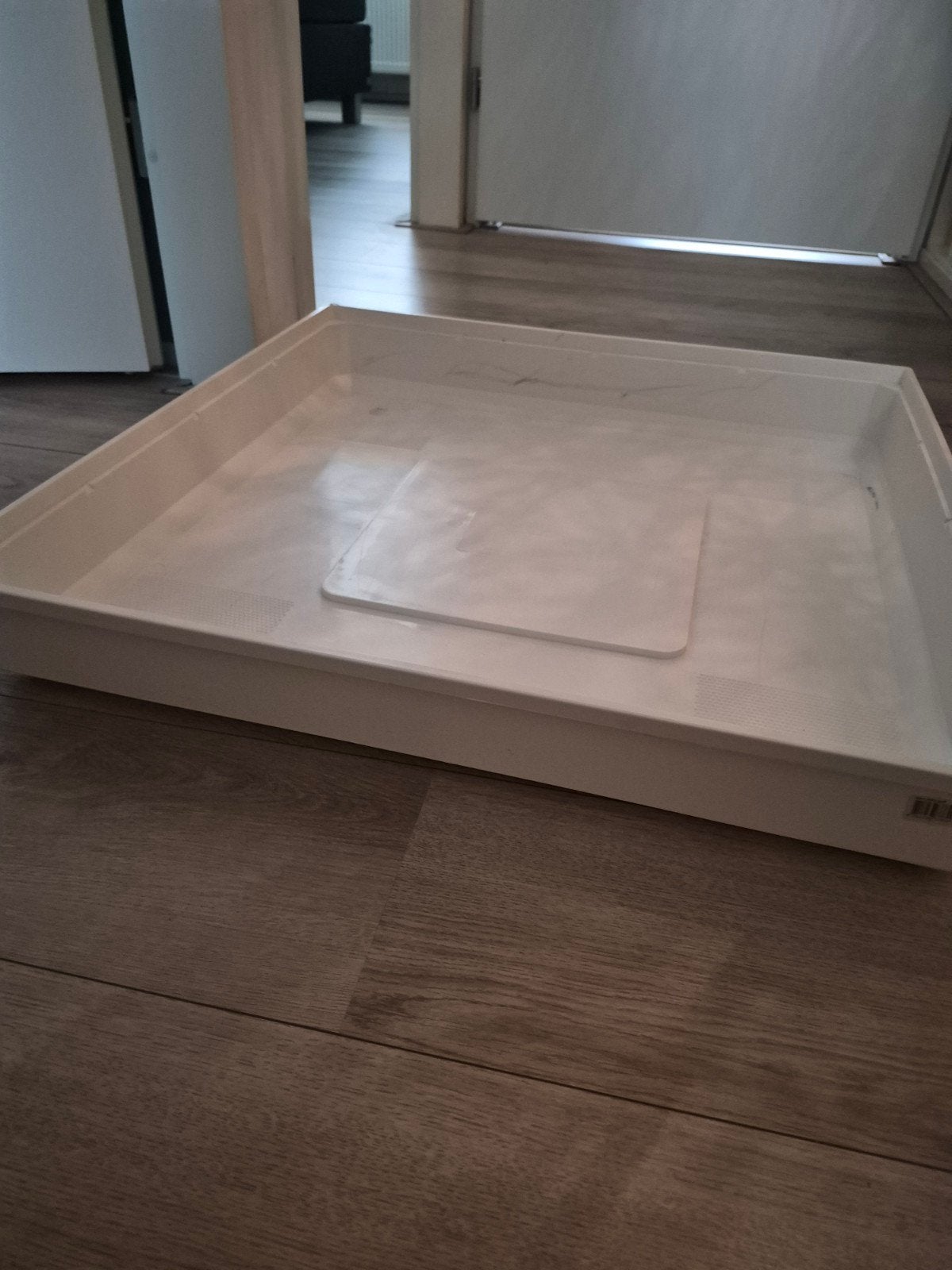 Lekbak wasmachine, Ophalen