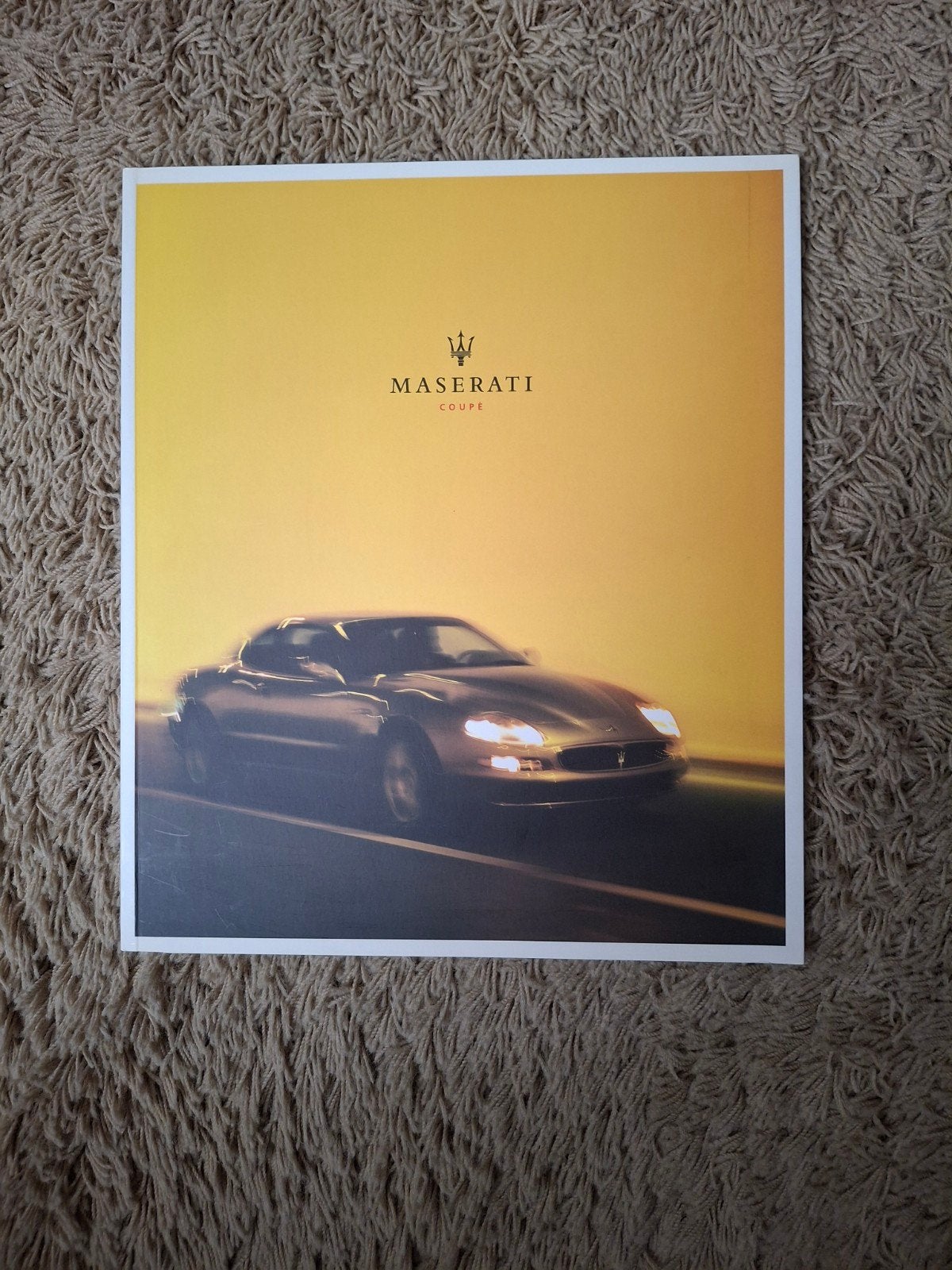 Autofolder Maserati Coupe, Verzenden, Overige merken
