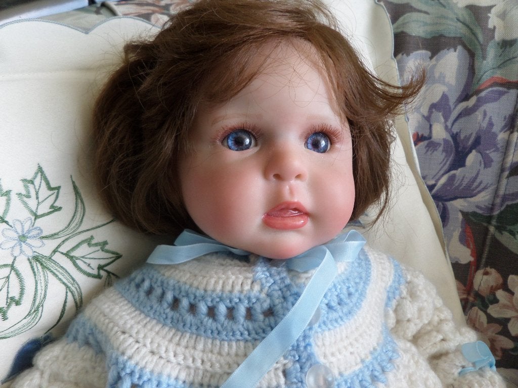 een schattige babypop 50 cm, Ophalen of Verzenden