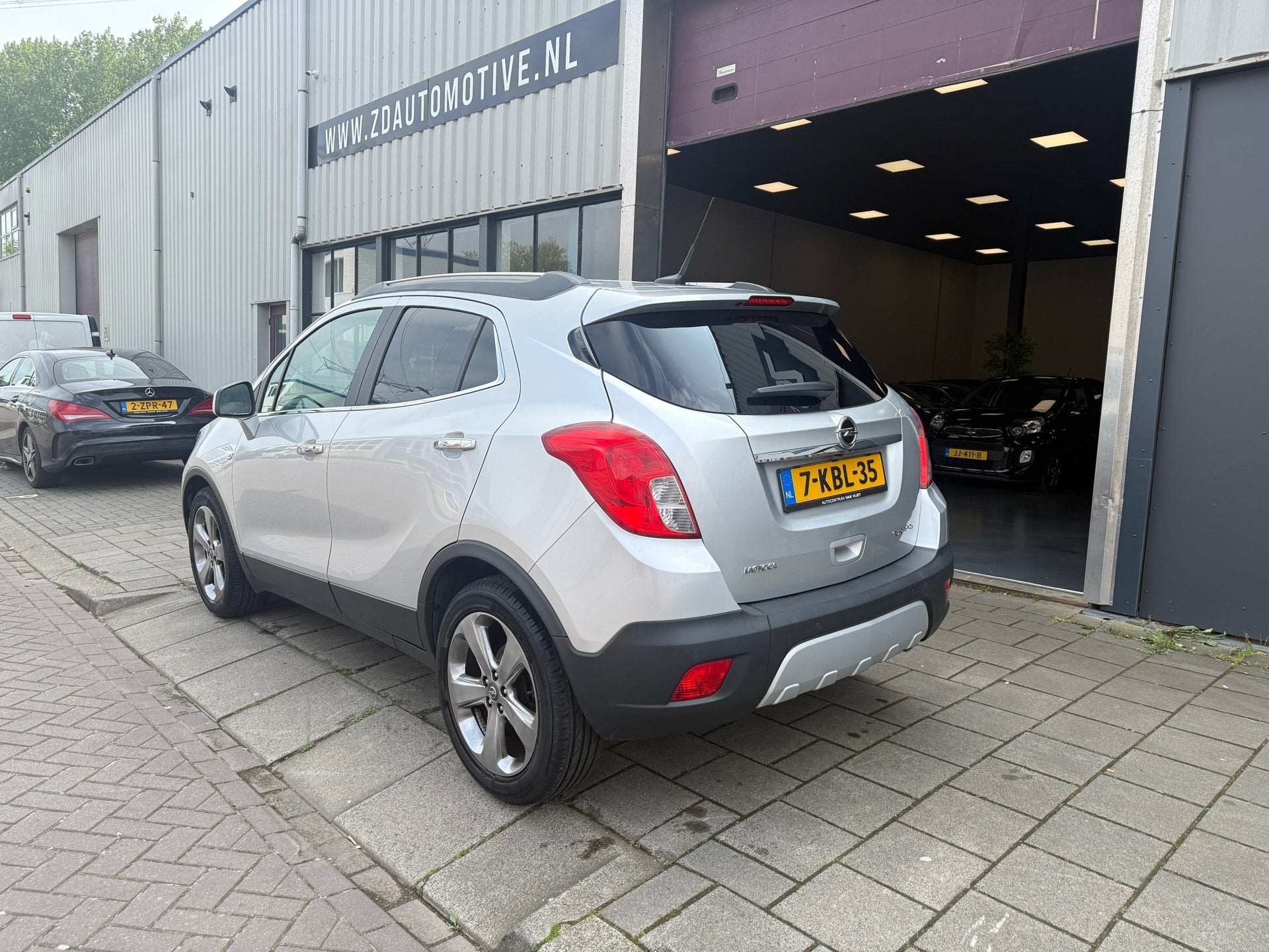 Opel Mokka 1.4 T Cosmo 4x4, Auto's, Euro 5, 1325 kg, Gebruikt, Parkeersensor