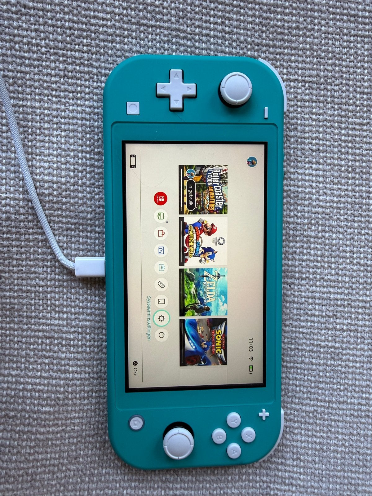 Nintendo Switch Lite Turquoise + 3 games + etui, Spelcomputers en Games, Ophalen of Verzenden, Turquoise, Gebruikt, Met beschermhoes of tas