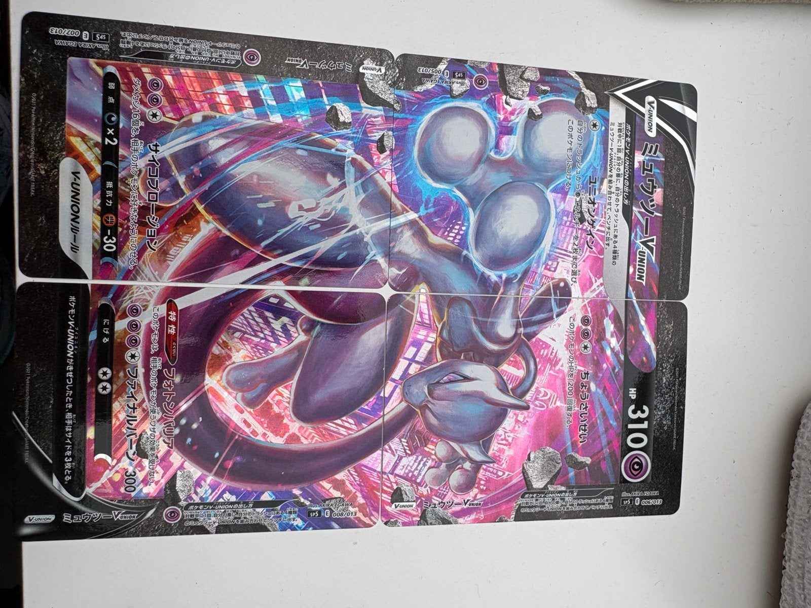Mewtwo v union, Ophalen of Verzenden, Zo goed als nieuw, Meerdere kaarten, Foil