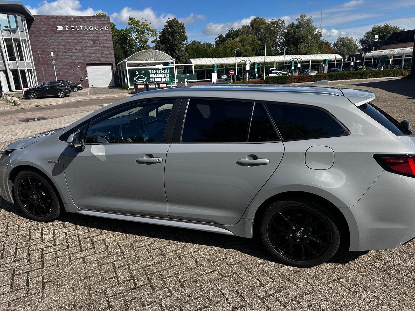 Toyota Corolla TS 1.8 Hybrid 122pk CVT 2020 Grijs, Auto's, 450 kg, 750 kg, 4 cilinders, Stationwagon
