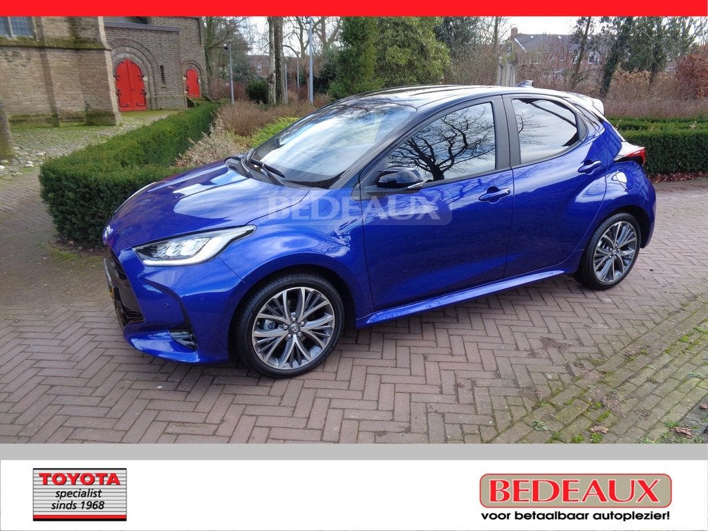 TOYOTA Yaris Hybrid 130pk CVT Executive bij Toyota specialis, Auto's, Toyota, 12 maanden, 450 kg, Gebruikt, Blauw