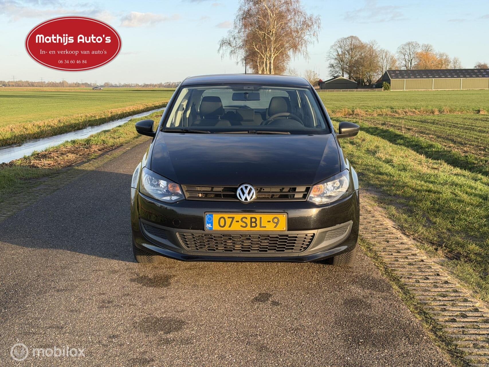 Volkswagen Polo 1.6 TDI Comfortline, Auto's, Voorwielaandrijving, Euro 5, Verwarmde buitenspiegels, Zwart