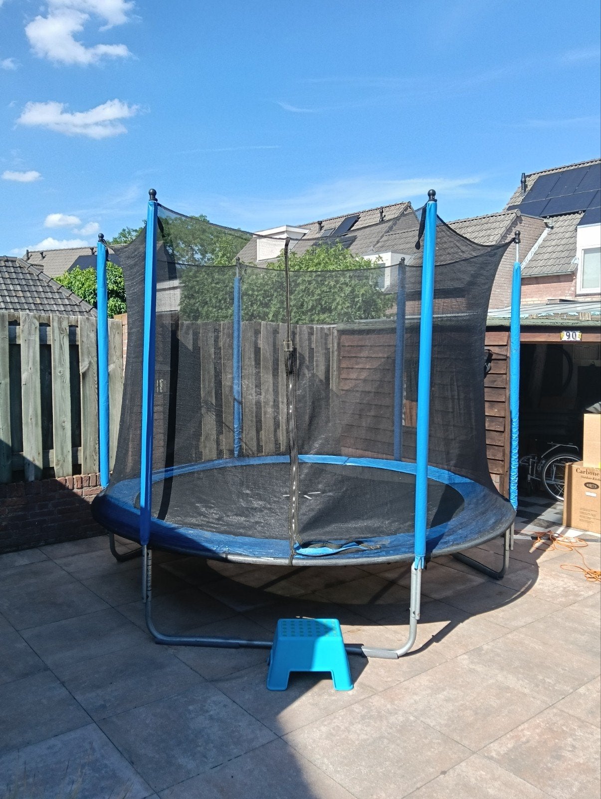 Grote trampoline met veiligheidsnet en trapje, Ophalen