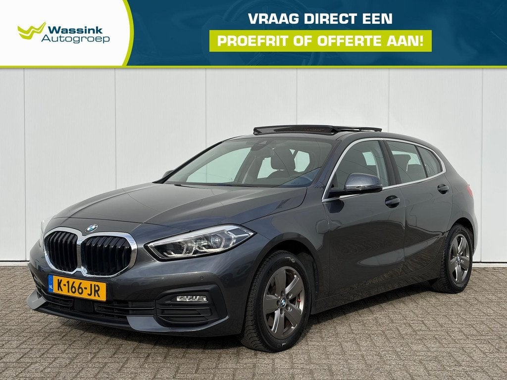 BMW 1 Serie (f40) 118i 136pk Executive Edition | Schuif -kan, Auto's, BMW, Gebruikt, Origineel Nederlands, Handgeschakeld, Grijs