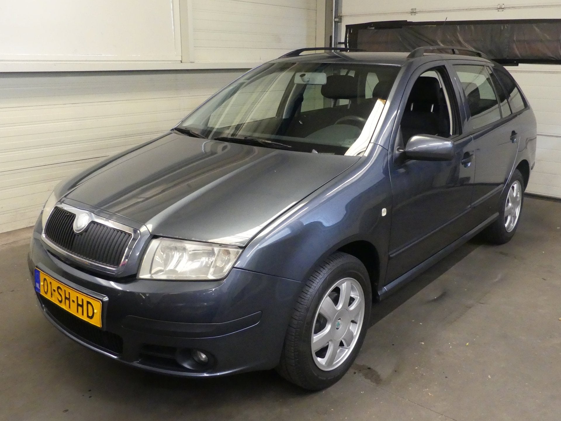 Skoda Fabia Combi 1.4-16V Elegance - Airco - Distributieriem, Voorwielaandrijving, Gebruikt, Zwart, 4 cilinders