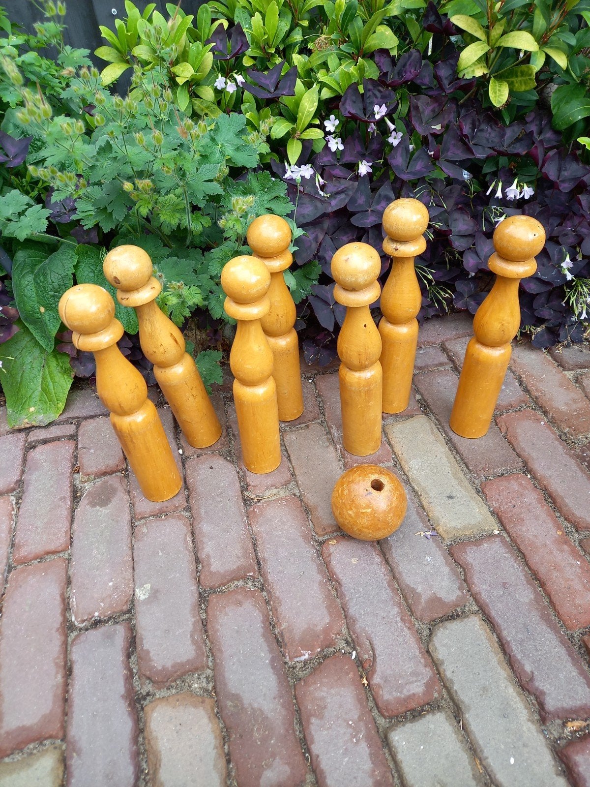 7 houten kegels met bal, Ophalen