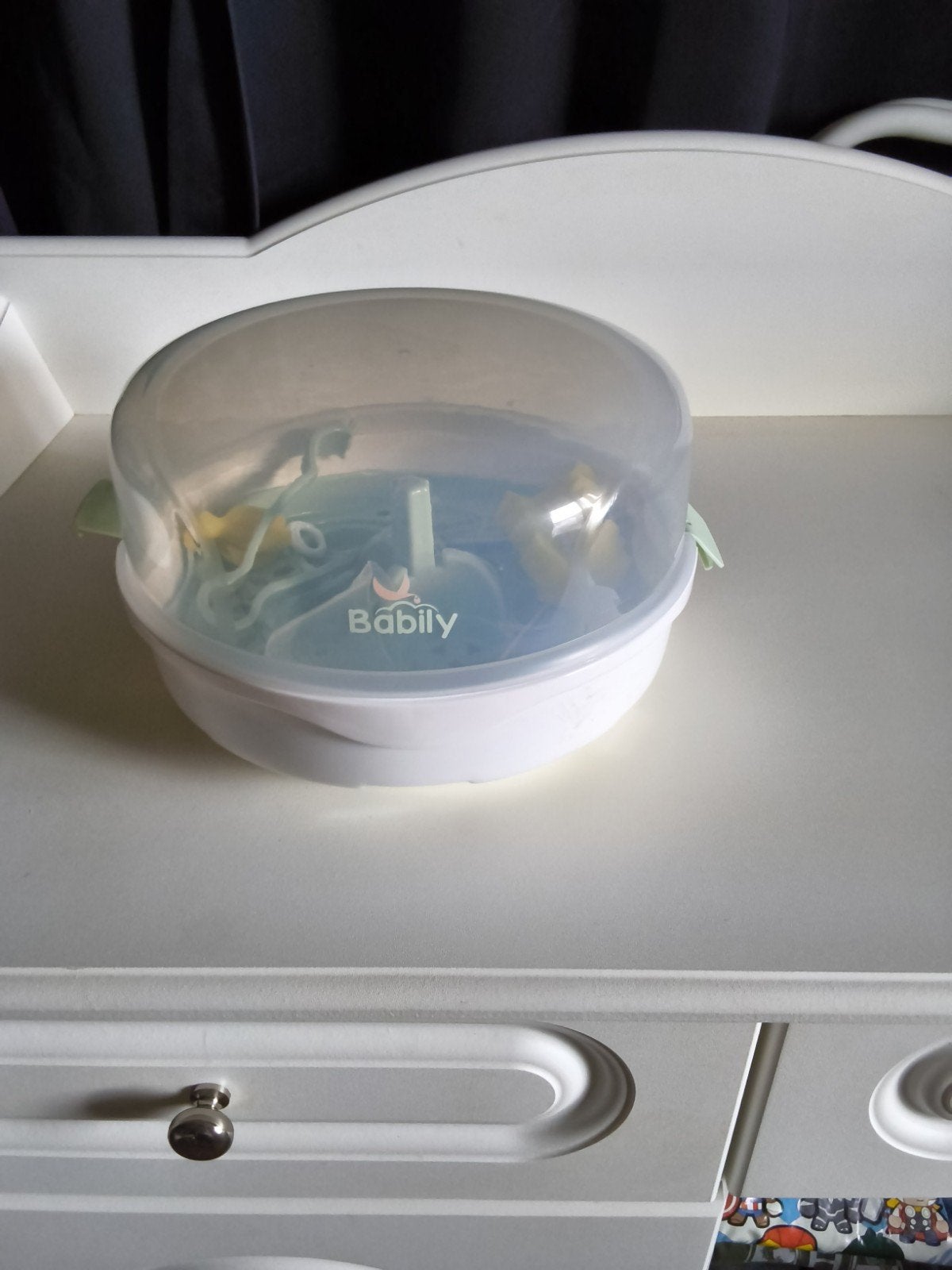 Magnetron sterilisator voor flessen, spenen en bekers, Ophalen