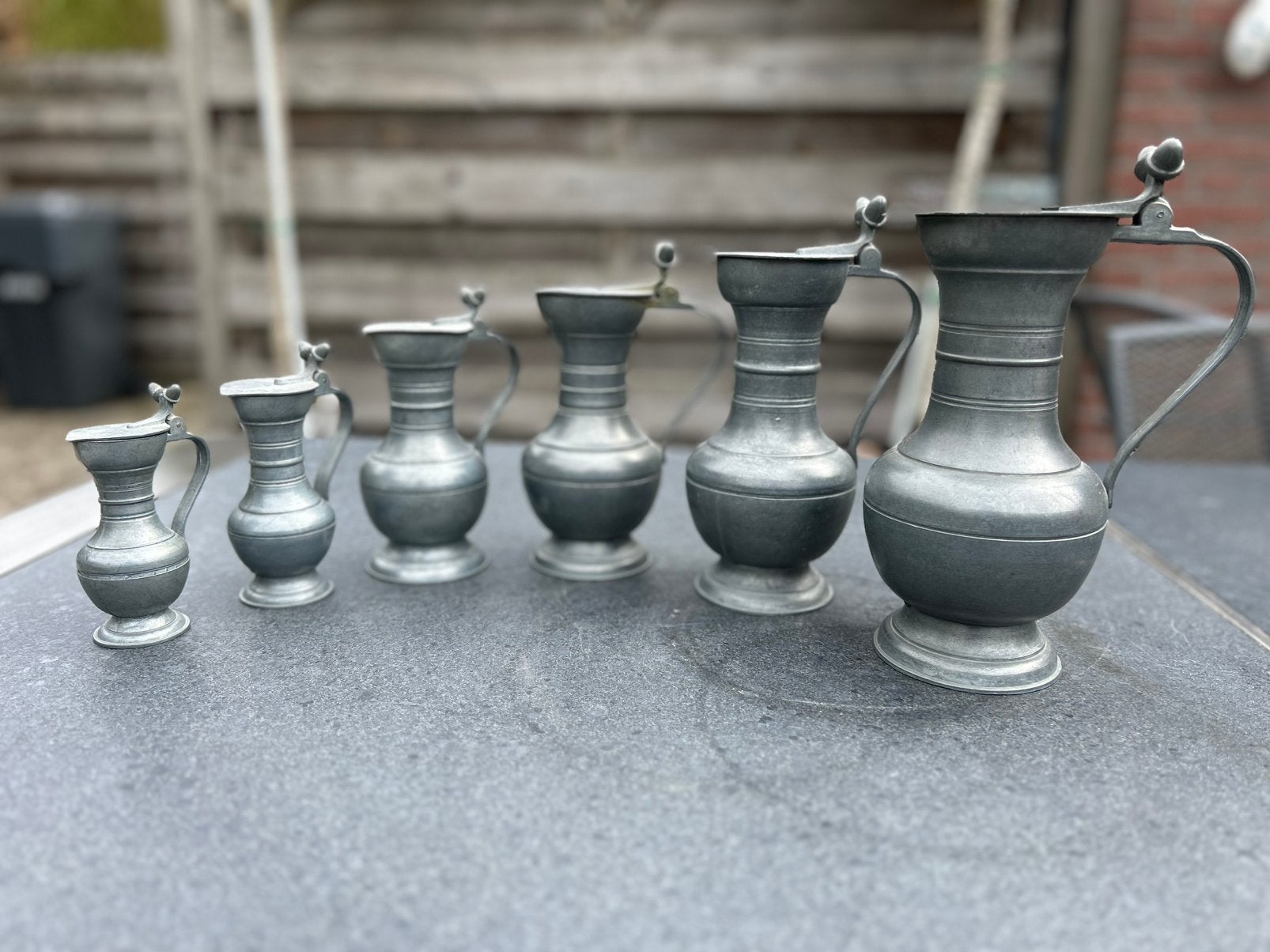 Set van 6 antieke tinnen kannen - oplopende maten, Ophalen of Verzenden