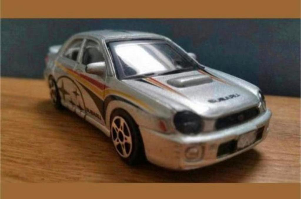 Subaru Impreza WRX STI – Bburago 1:43, Ophalen of Verzenden, Gebruikt, Auto, Overige merken