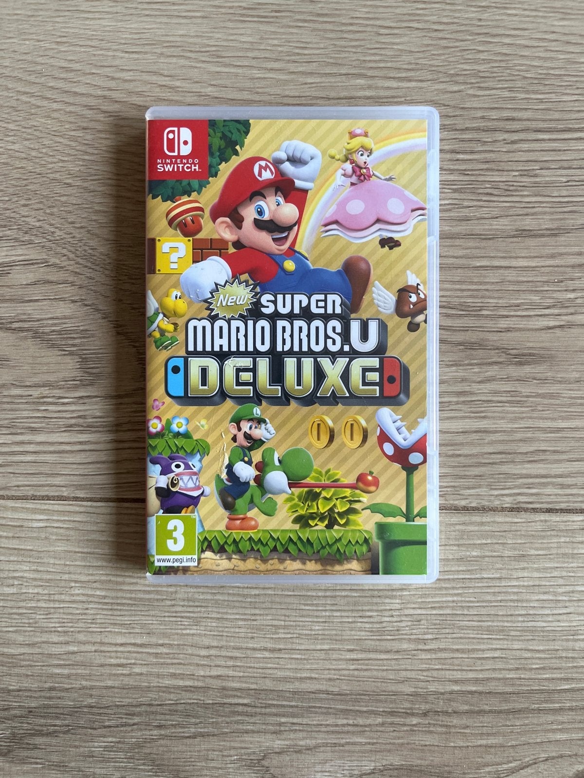 New Super Mario Bros. U Deluxe - Nintendo Switch, Spelcomputers en Games, Ophalen, Eén computer, Zo goed als nieuw, Platform