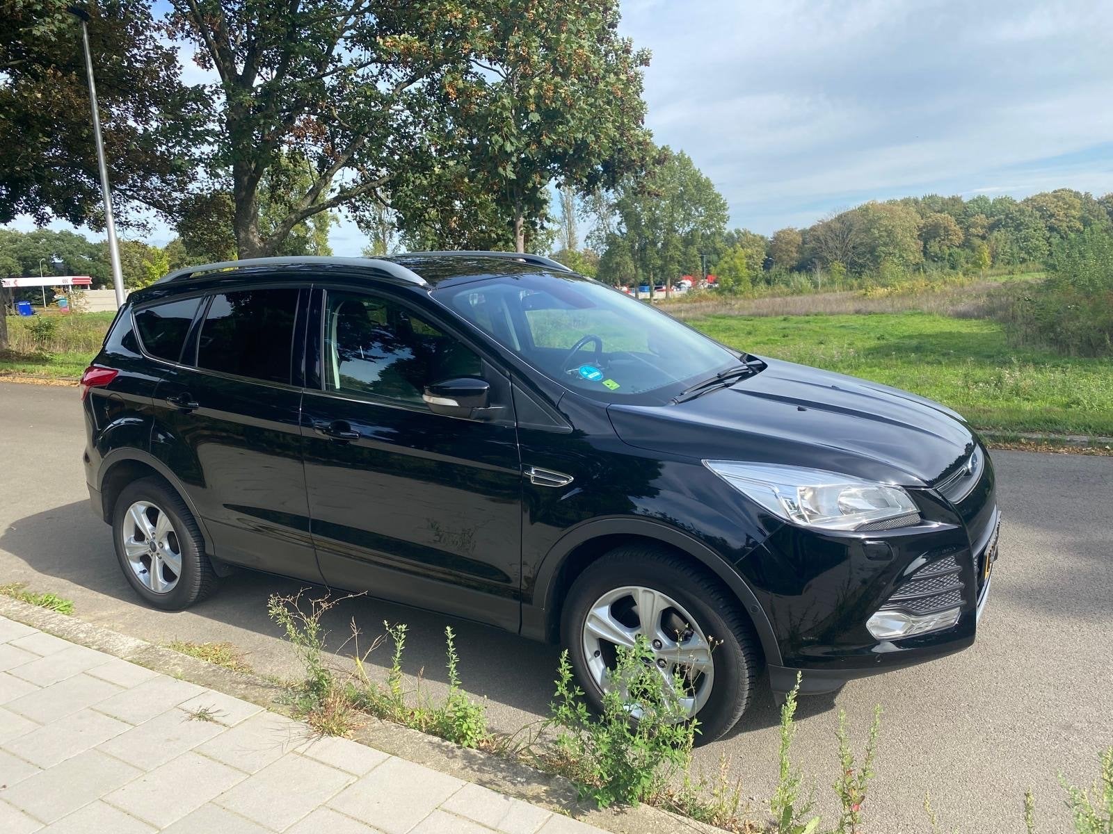 Ford Kuga 1.5 Ecoboost 150pk Tredd Ultimate 2WD 2015 Zwart, Auto's, Stof, 1498 cc, Zwart, 4 cilinders