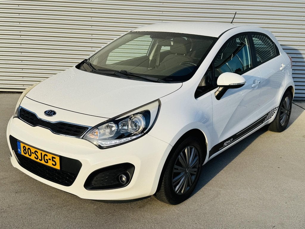 Kia Rio 1.2 SuperPack 85pk Clima | Cruise |Keyless | PDC & A, Auto's, Kia, Euro 5, 4 cilinders, Wit, Origineel Nederlands